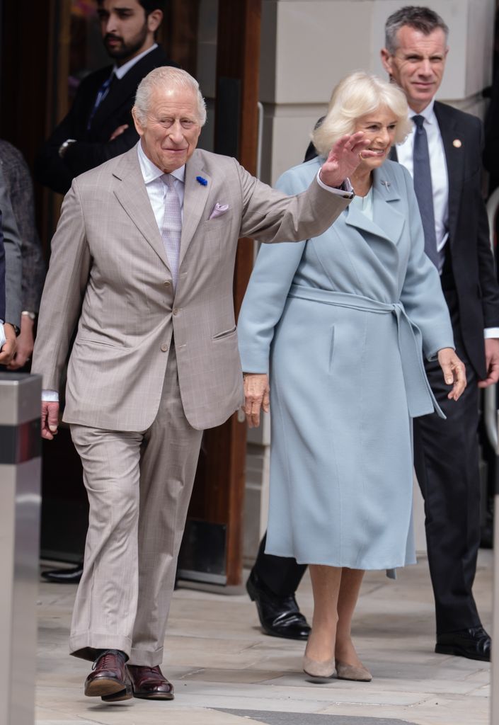 King Charles III and Queen Camilla waving