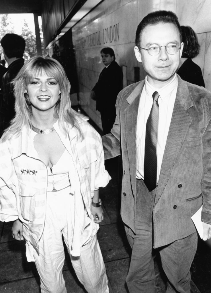 Black and white photo of Toyah Willcox in a white outfit and Robert Fripp in a suit