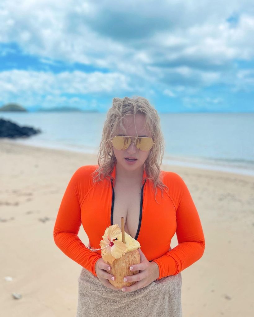 Rebel Wilson in an orange swimsuit in a photo shared from her vacation in Fiji