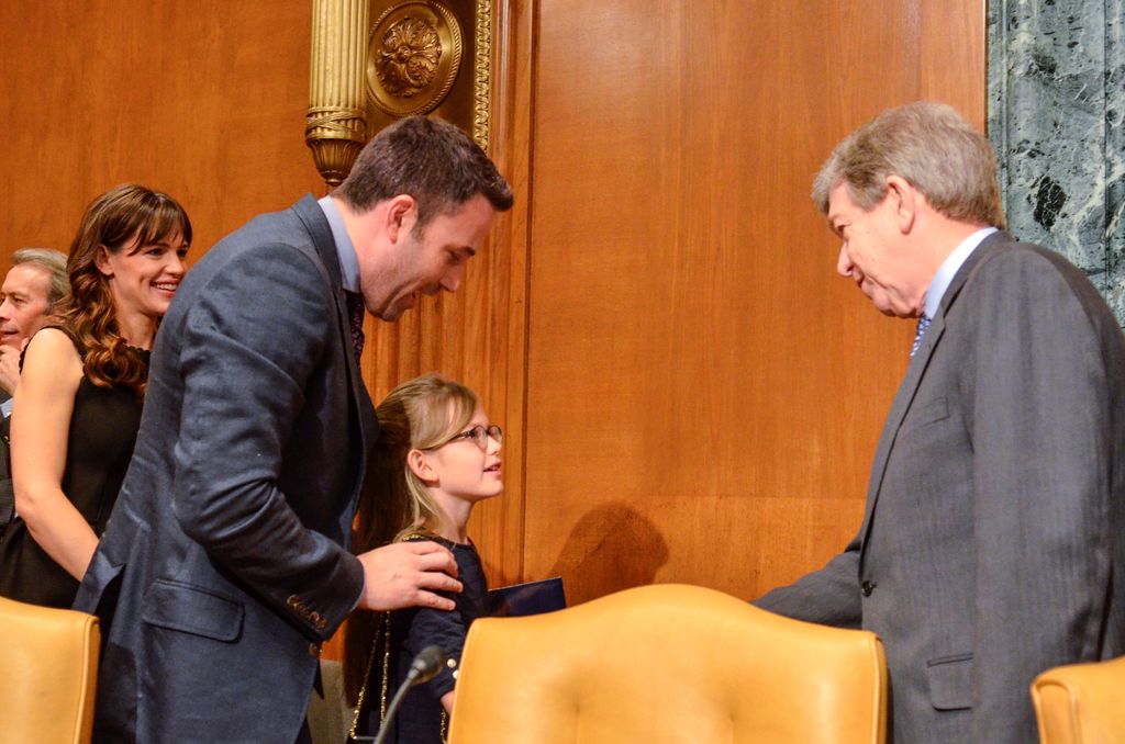 Ben Affleck with wife Jennifer Garner and their daughter Violet Affleck shake hands with Sen. Roy Blunt(R-MI) a senate hearing room after Ben with Bill Gates spoke during a Senate Appropriations' subcommittee on State, Fo