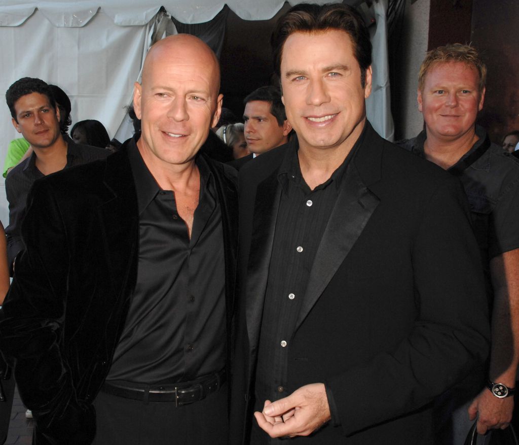 Bruce Willis and John Travolta during 2007 MTV Movie Awards - Backstage and Audience at Gibson Amphitheater in Los Angeles, California, United States. ***Exclusive*** (Photo by Jeff Kravitz/FilmMagic, Inc)