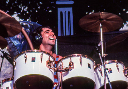 Keith Moon smiling playing the drums