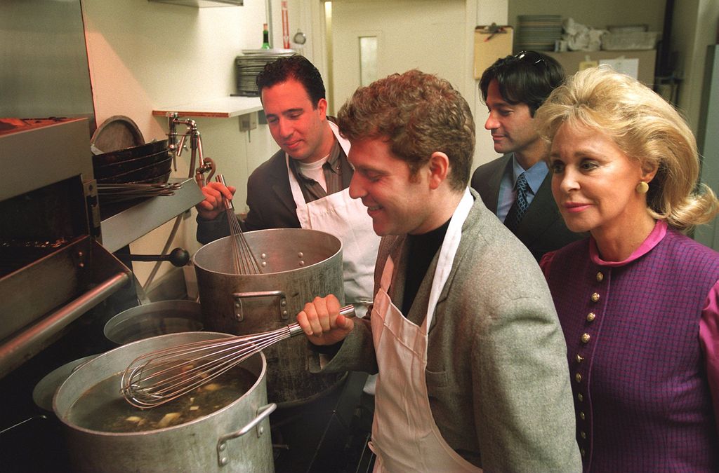 At Cafe Louis, cooking for Max Warburg Foundation dinner benefit. Chef Michael Schlow, Chef Bobby Flay of NY's Mesa Grill, Seth Grenberg and Joan Kennedy checking out the menu, 1997