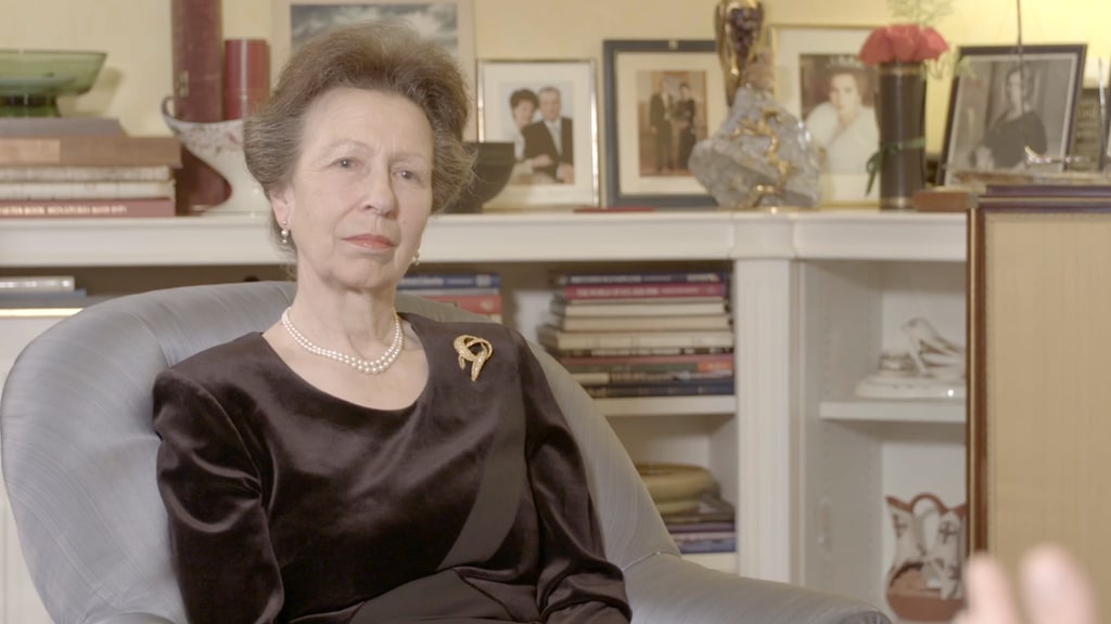 princess anne in grey armchair at home