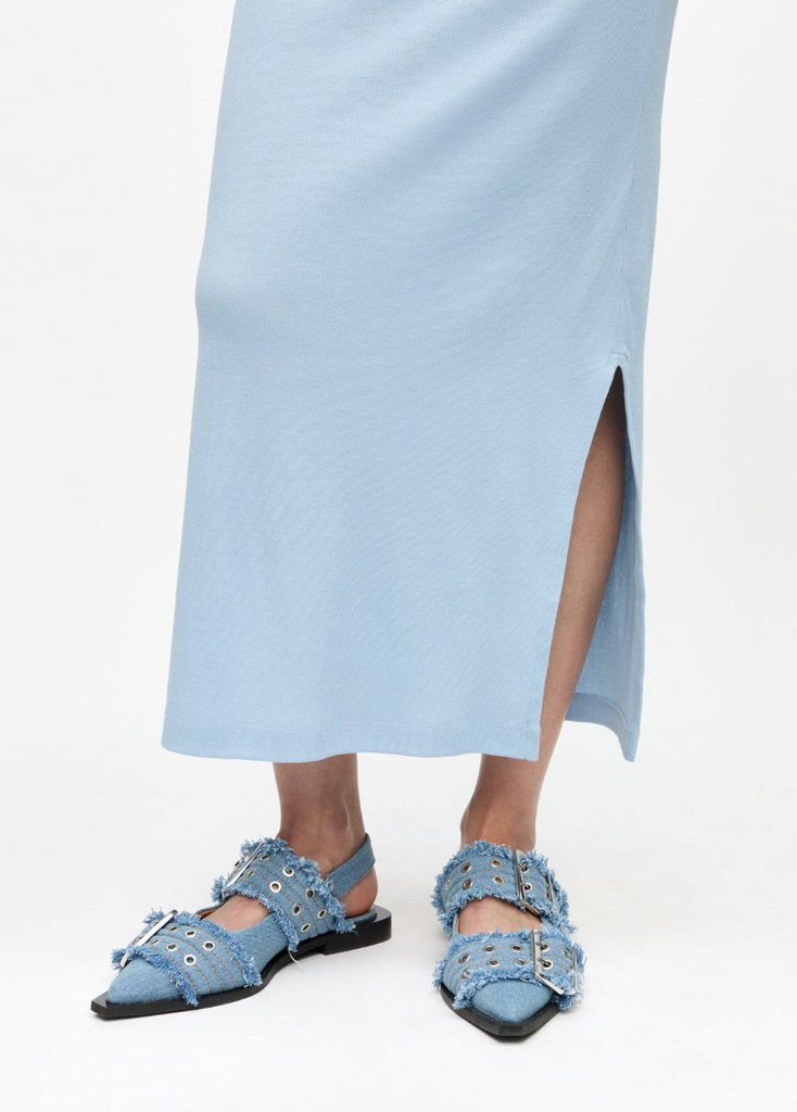 A Photo of models legs wearing denim ballet slides from Ganni