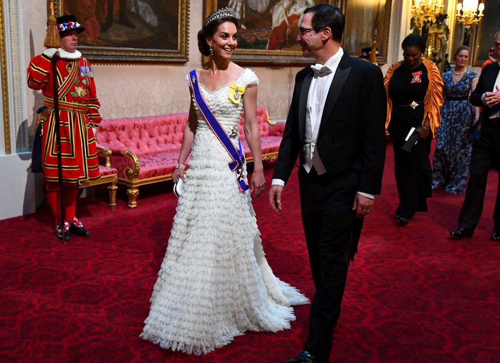 Kate Middleton wearing white dress and tiara