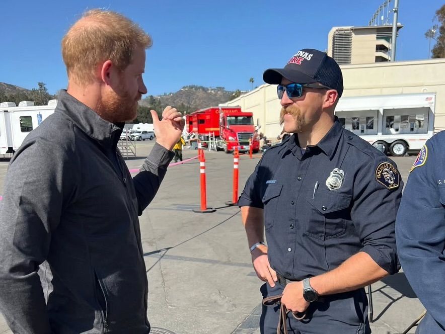 two men speaking outside 