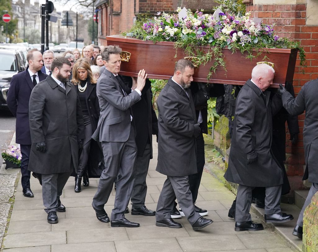 Kate Garraway follows the coffin into the funeral service of her husband Derek Draper