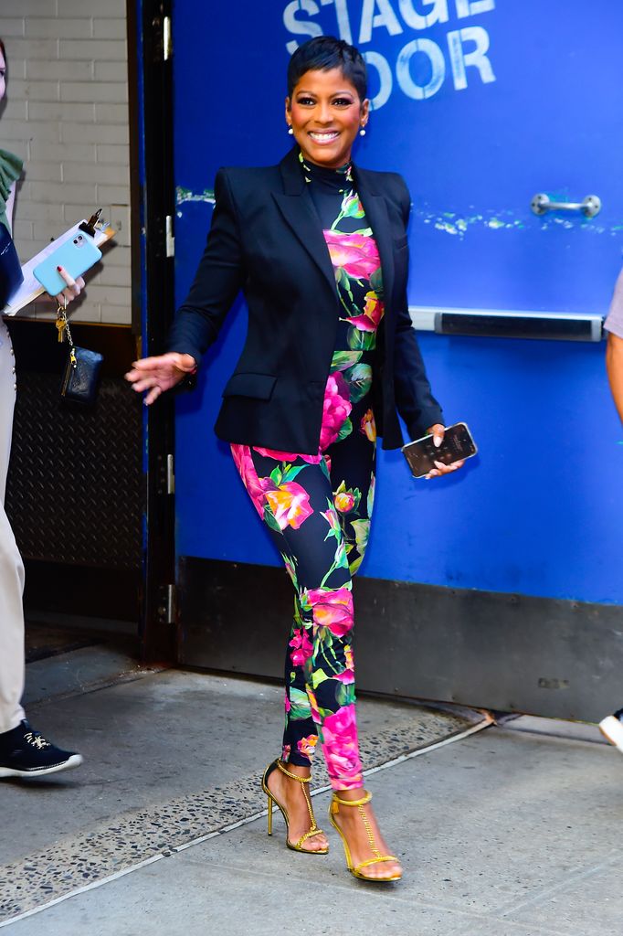 tamron hall wearing dolce and gabbana floral catsuit