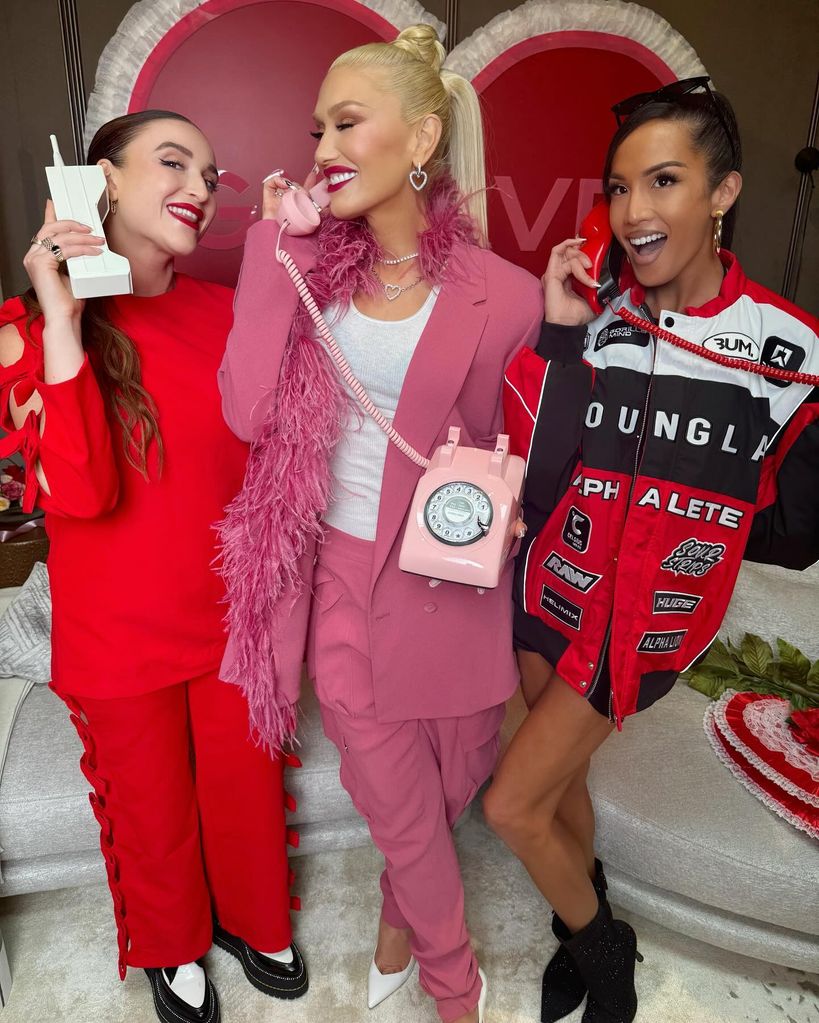 Gwen with two girls in a hot pink suit 