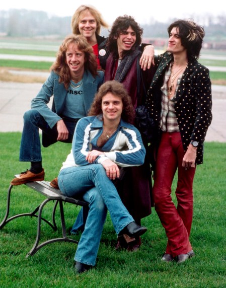 Aerosmith posing for a photo together