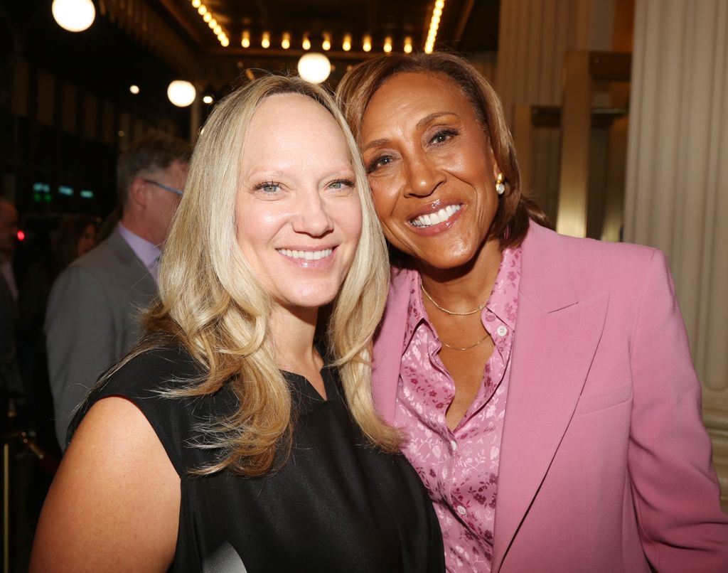 Amber Laign and wife Robin Roberts pose at the opening night of the new play "Left on Tenth" on Broadway at The James Earl Jones Theater on October 23, 2024 in New York City