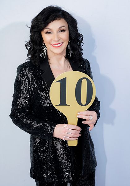 Shirley Ballas holding a 10 paddle