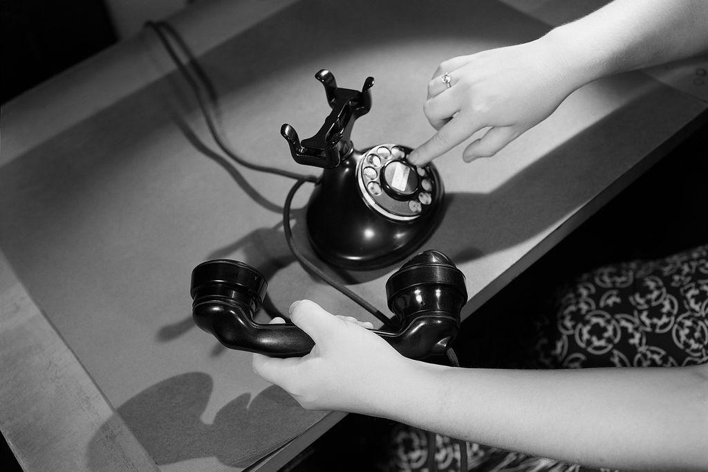 (Original Caption) A view of a woman's hands dialing a rotary telephone. Undated photograph. (Photo by ï¿½ï¿½ Bettmann/CORBIS/Corbis via Getty Images)