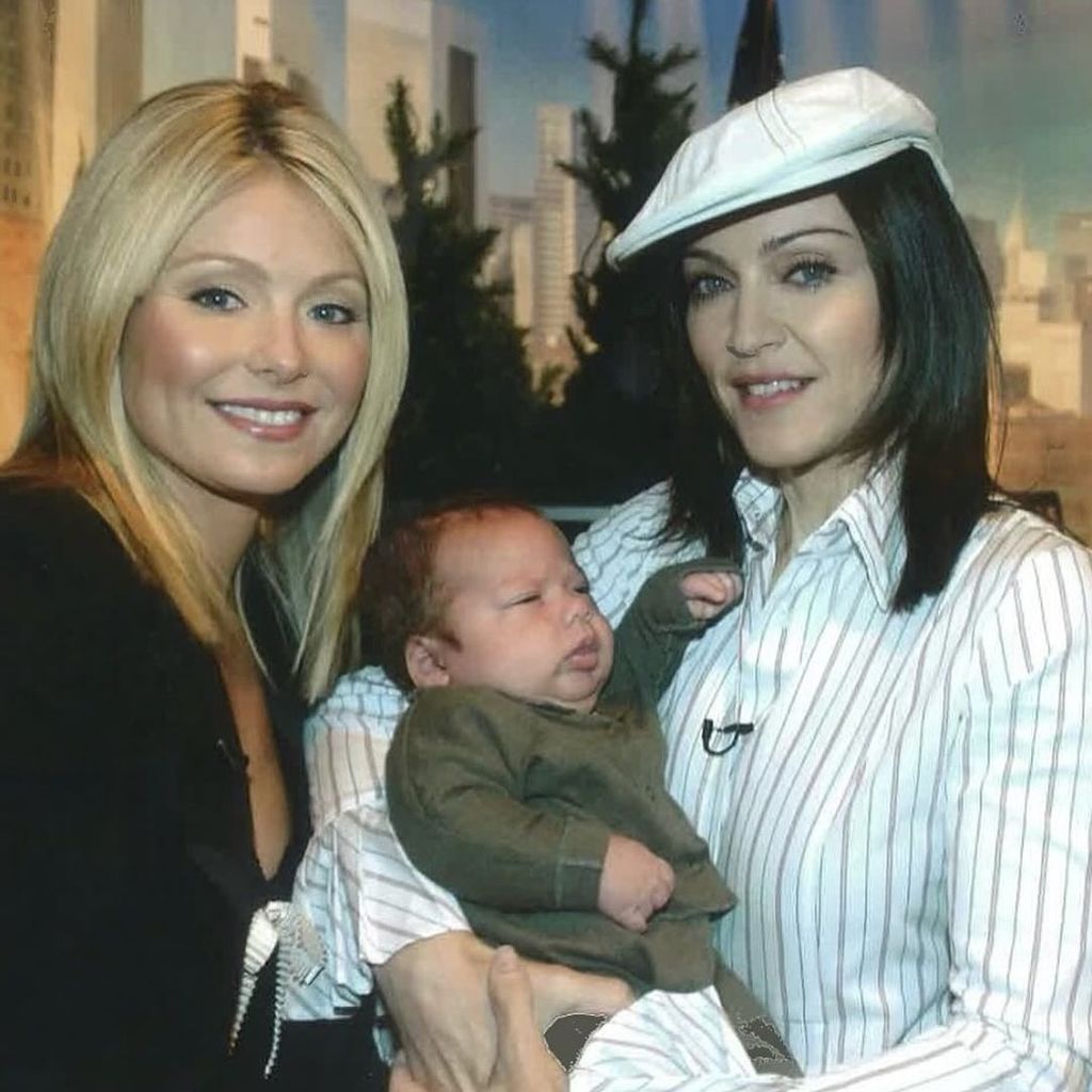 Kelly Ripa with Madonna holding her son Joaquin as a baby