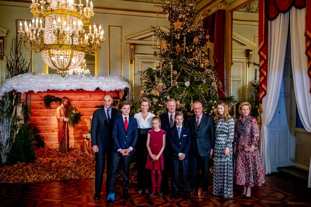 Members of the Belgian royal family stood in front of a Christmas tree and Nativity scene