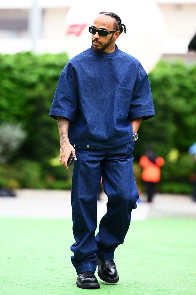 Lewis Hamilton of Great Britain and Mercedes walks in the Paddock during previews ahead of the F1 Grand Prix of Singapore at Marina Bay Street Circuit on September 19, 2024 in Singapore, Singapore. (Photo by Clive Mason/Getty Images)