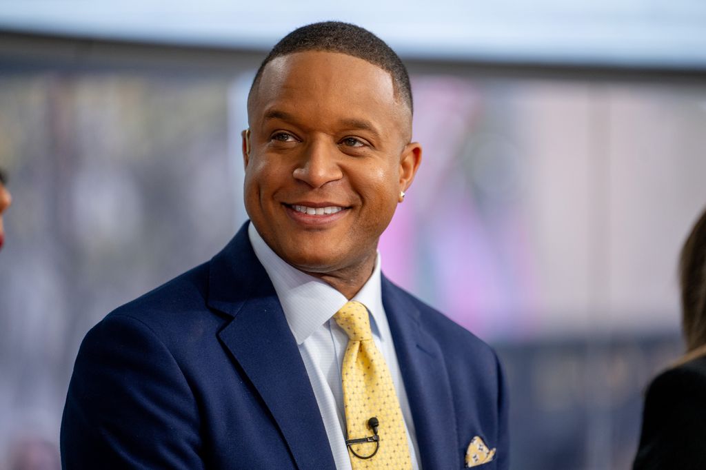 Craig smiling on set of Today wearing suit and earring