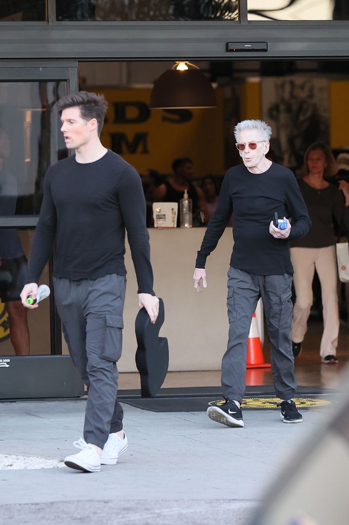photo of calvin klein and boyfriend kevin baker leaving a gym in matching outftis