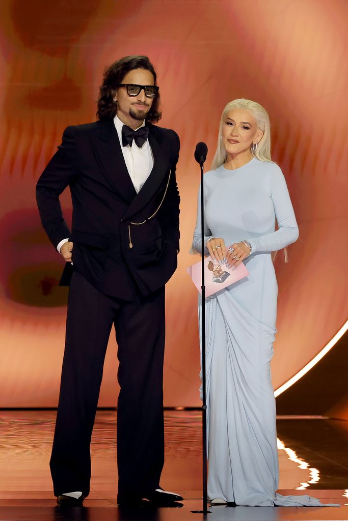 Maluma and Christina Aguilera speak onstage during the 66th GRAMMY Awards at Crypto.com Arena on February 04, 2024 in Los Angeles, California