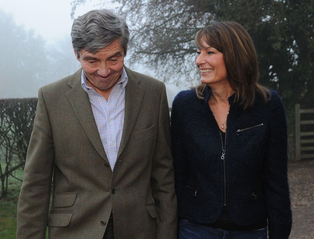 Carole Middleton laughing and looking at Michael who pulls a face