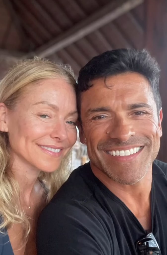 A clip from a video Kelly Ripa shared on Instagram in September 2023 in which she stands next to her husband, Mark Consuelos, while they were on a beach vacation with their kids.