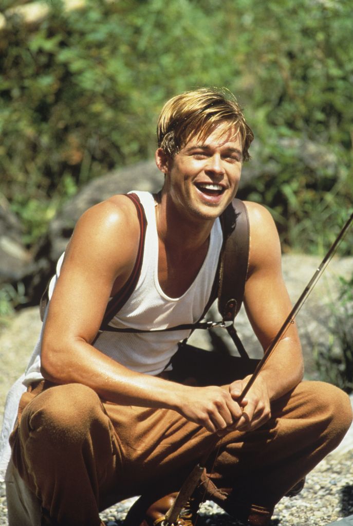 Brad Pitt smiles while fishing on the Gallatin River during the filming of 'A River Runs Through It' in 1991