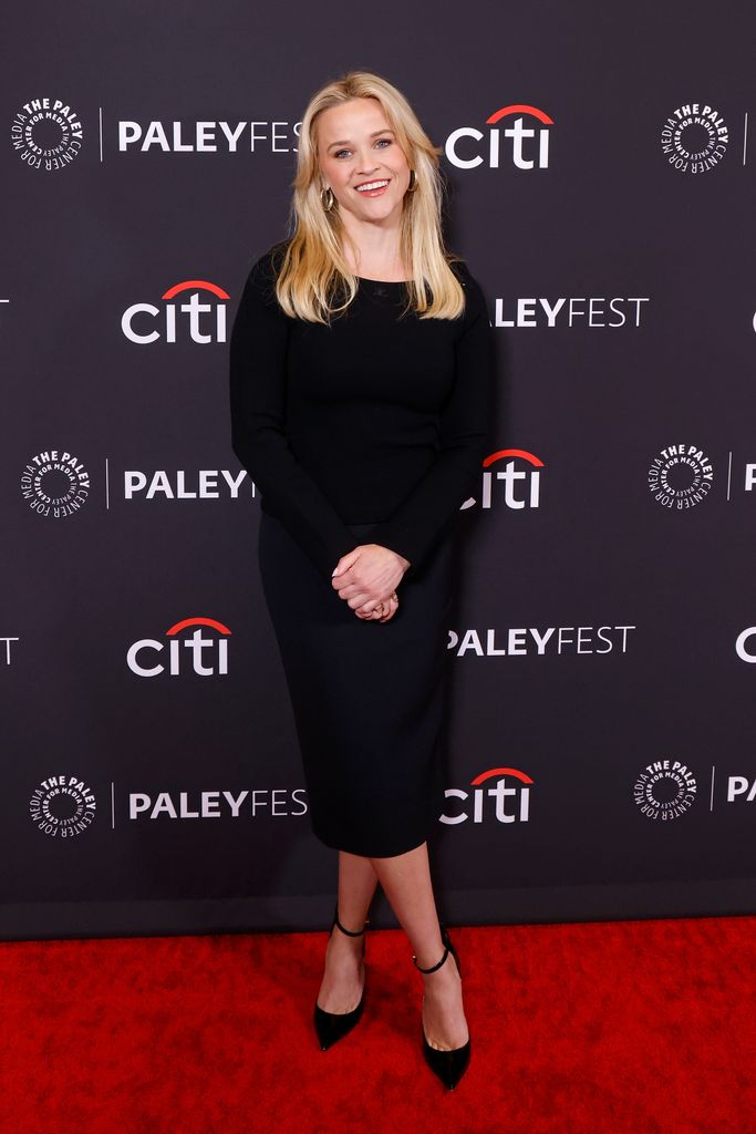 Reese Witherspoon on red carpet in black midi dress 