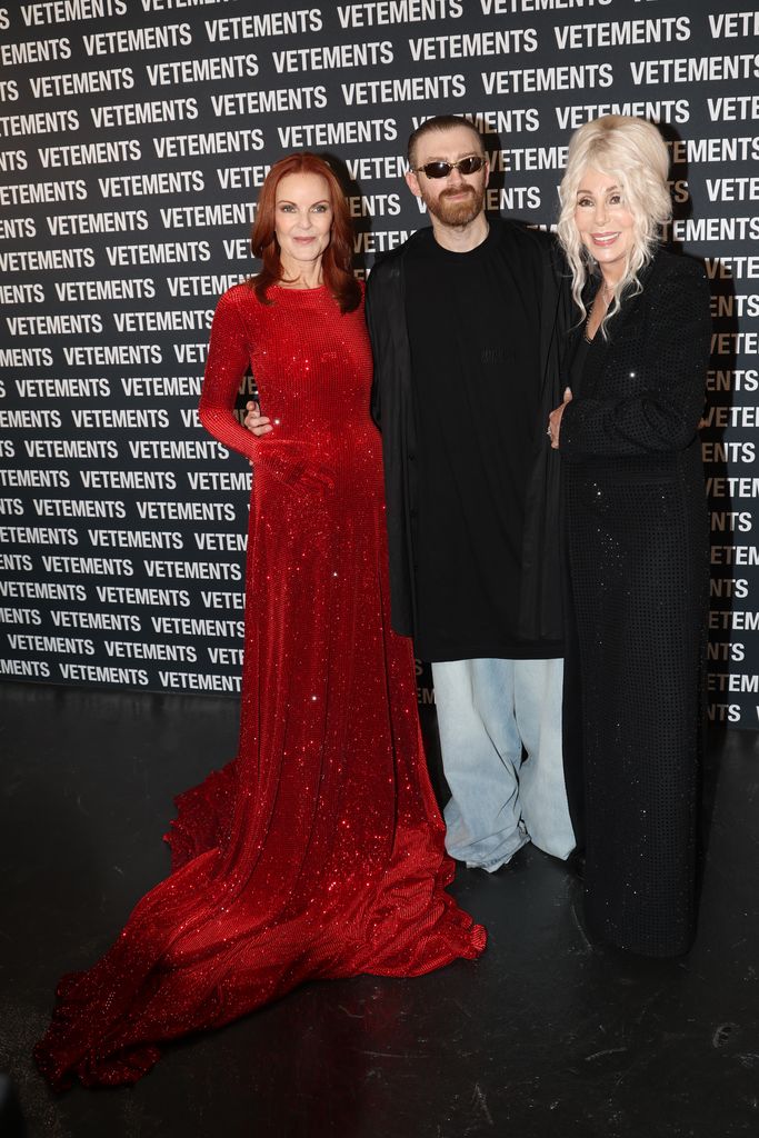 Cher posing with Marcia Cross and Guram Gvasalia 