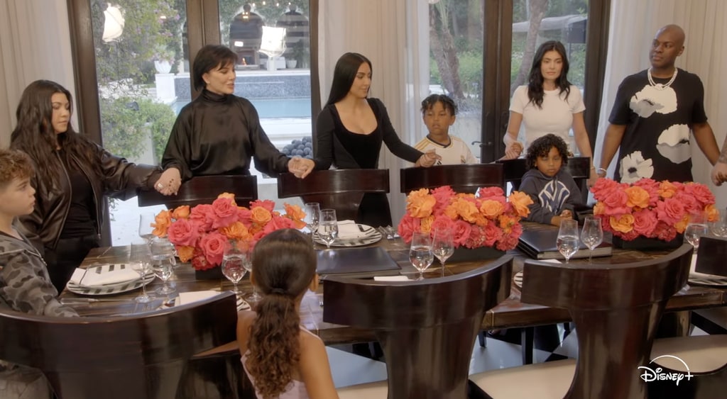 kardashian-jenner around a table holding hands