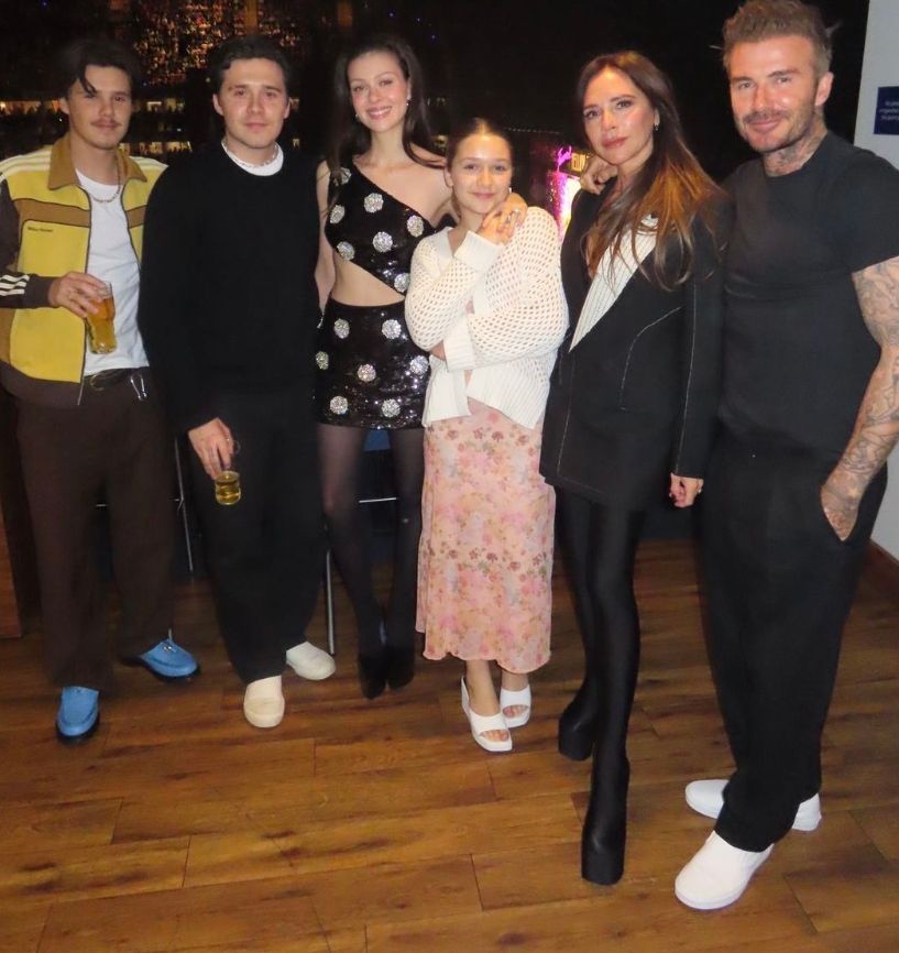 Cruz Beckham standing with Brooklyn Beckham, Nicola Peltz, Harper Beckham, Victoria Beckham and David Beckham