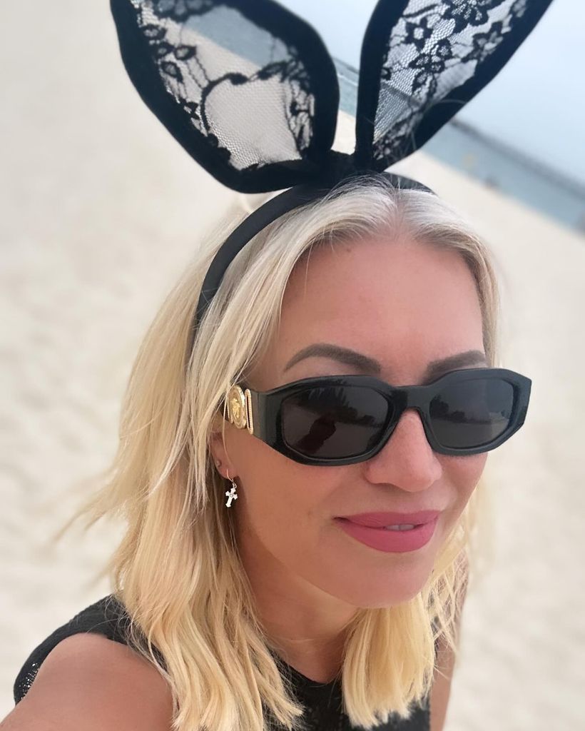 woman wearing sunglasses and lace bunny ears 