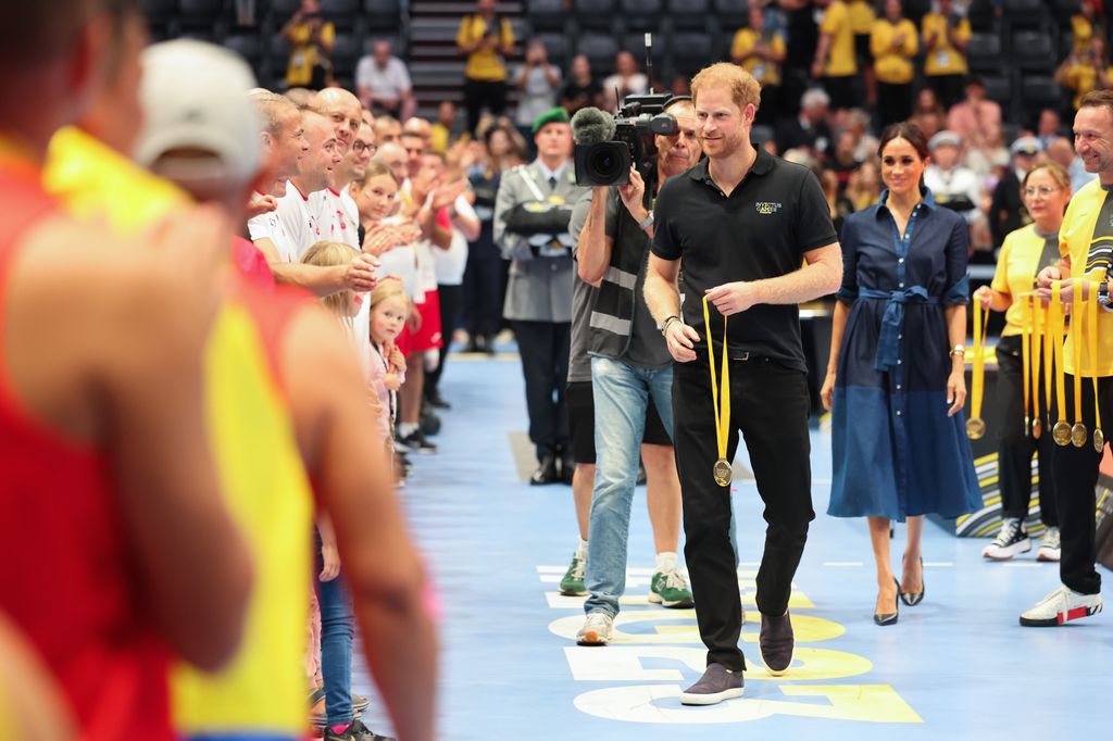 Prince Harry, Duke of Sussex awards silver medals after the sitting volleyball finals at the 2023 Invictus Games