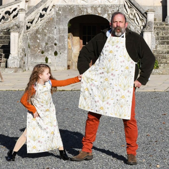 Dick Strawbridge and daughter Dorothy wearing aprons