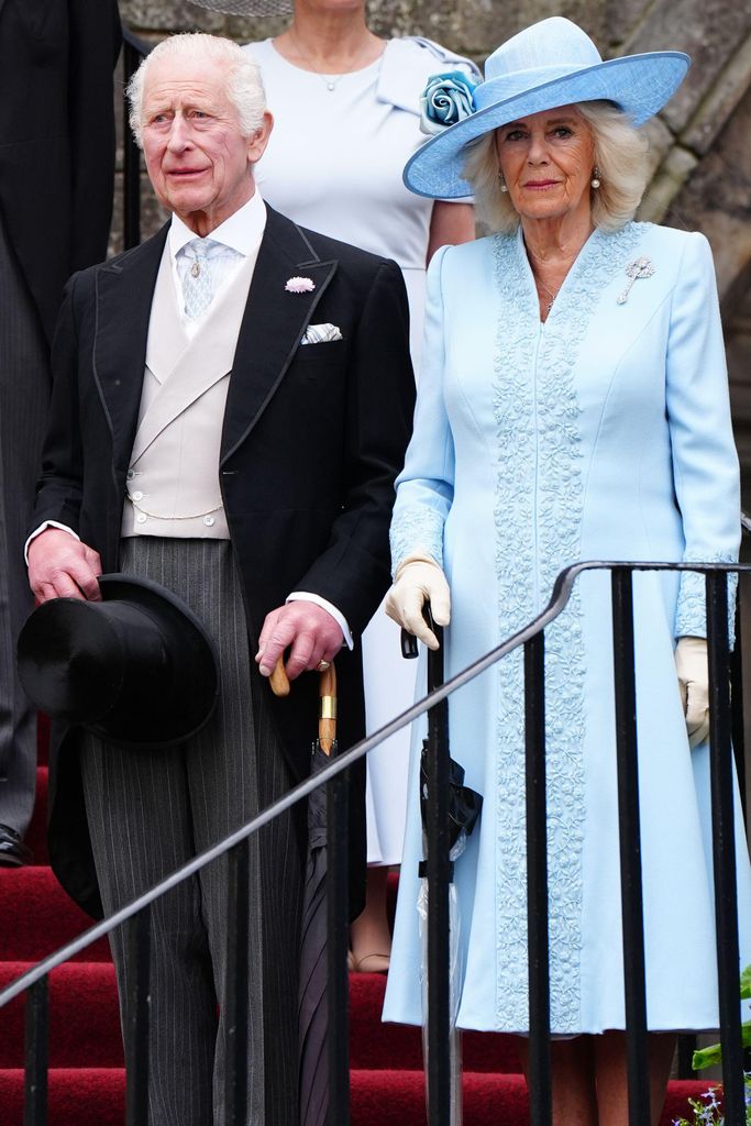 King Charles and Queen Camilla, wearing blue coat, at Scottish garden party