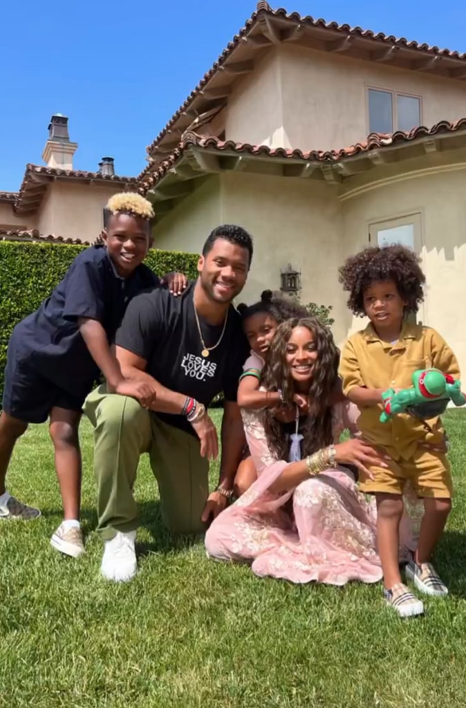 Still from a video shared on Instagram by Ciara where she and her husband Russell Wilson are posing outside their home with kids Future, Sienna, and Win
