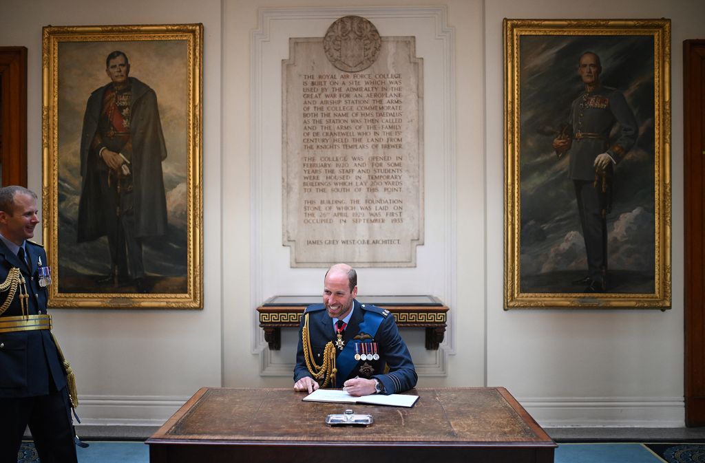 William signing visitors book at RAF Cranwell