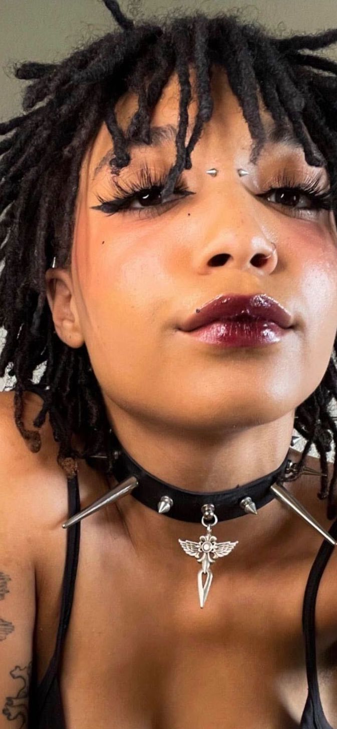 Willow Smith selfie in plum lipstick and a choker with a bridge piercing between her eyes