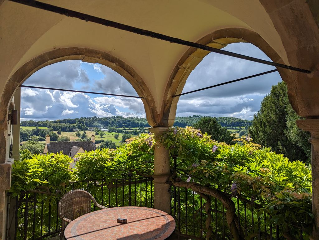 Sunny terrace at The Painswick with greenery