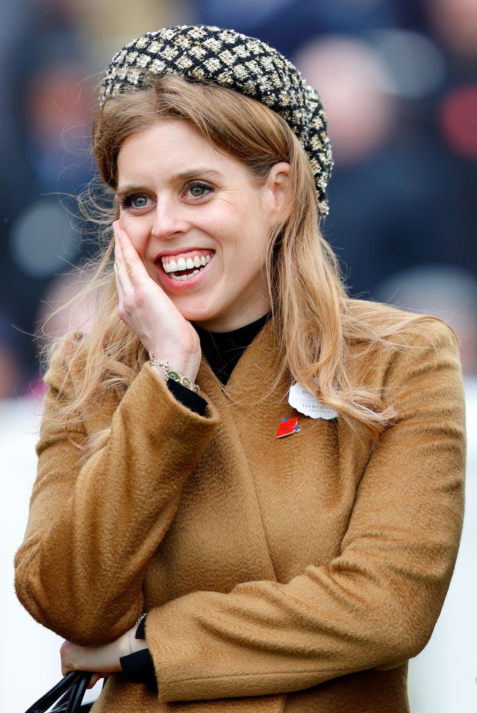 Princess Beatrice watches the racing as she attends day 3 'St Patrick's Thursday' of the Cheltenham Festival at Cheltenham Racecourse on March 14, 2024 in Cheltenham, England