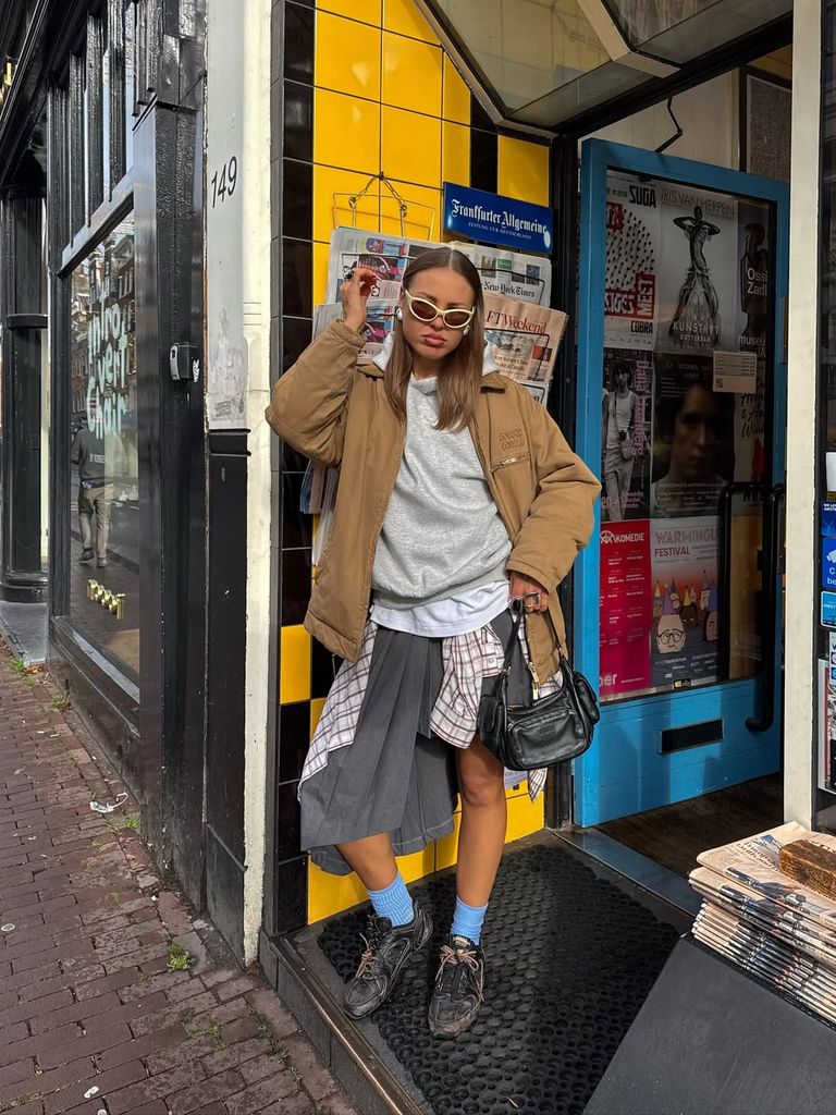 Olivia hirst with plaid shirt wrapped round skirt