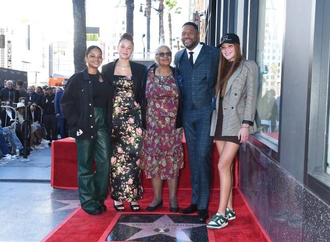 Michael Strahan with his mom and three daughters on the Hollywood Walk of Fame