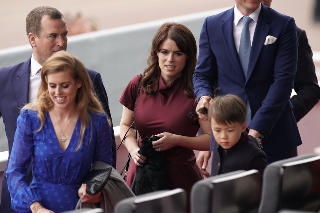 Wolfie with Eugenie and Beatrice and Peter Phillips at the Platinum Pageant 