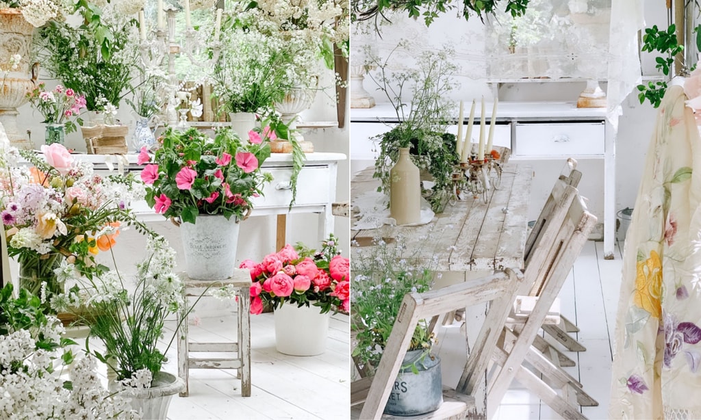 white room with table chairs and flowers