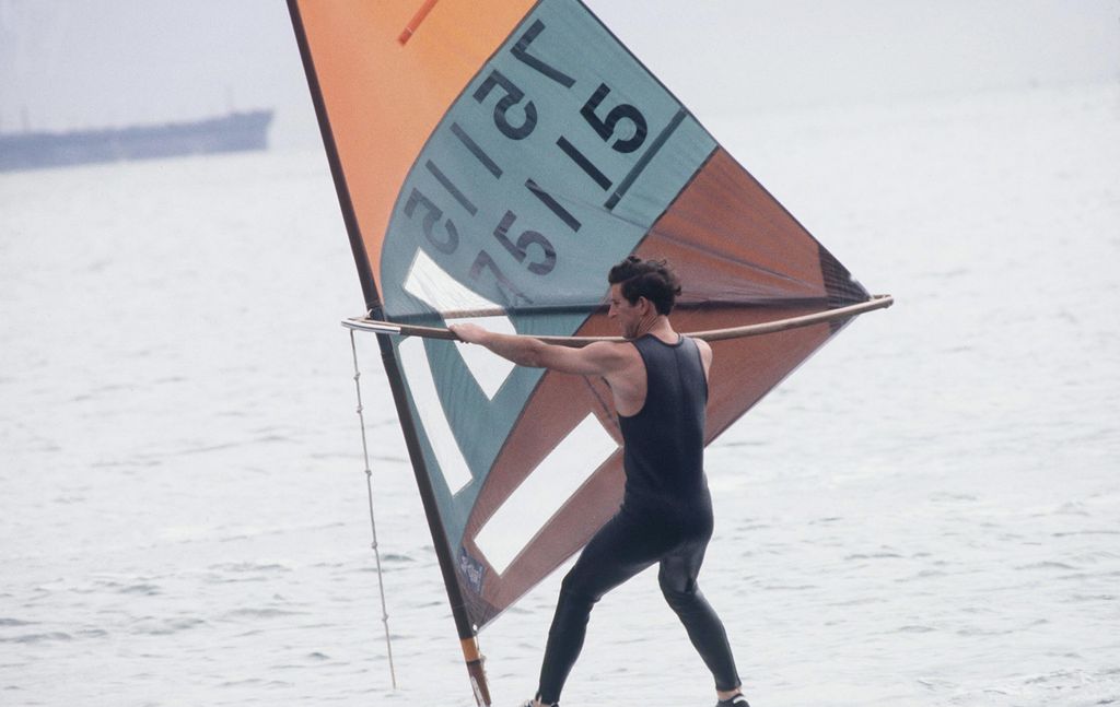 King Charles Windsurfing At Cowes in wetsuit 
