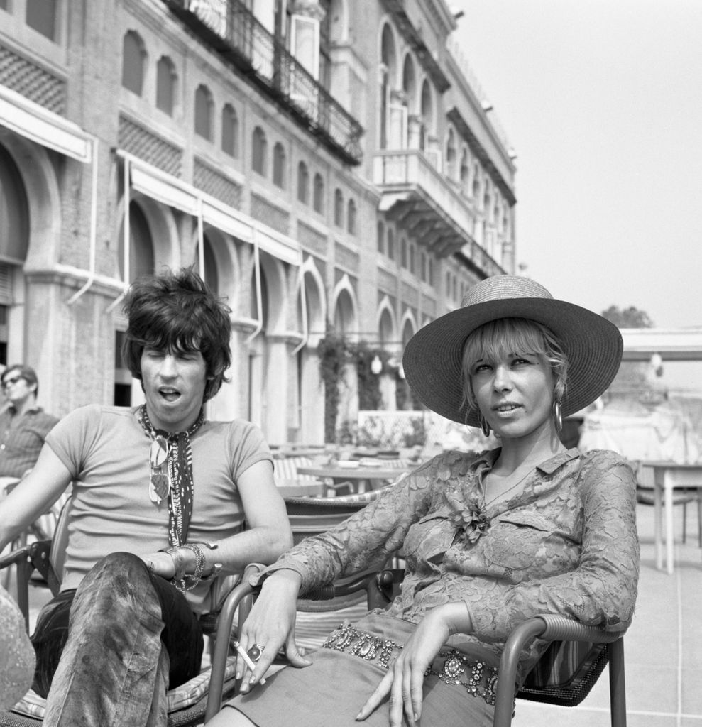 Keith Richards with Anita Pallenbergsitting outside the Excelsior Hotel, Lido, Venice, 1967. 