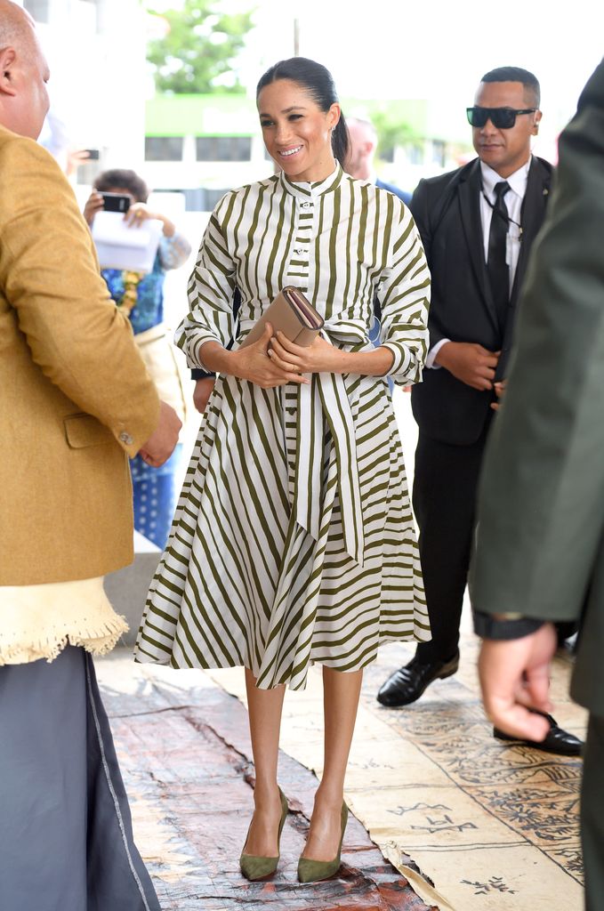 Meghan Markle with her Prada clutch during her royal visit to Tonga in 2018