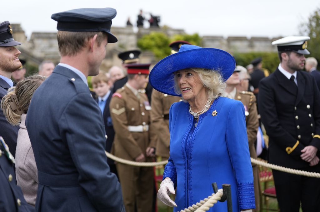 Queen Camilla meets military personal after a Beating Retreat military ceremony at Windsor Castle, Berkshire, on day two of the president's second state visit to the UK on September 17, 2025 in Windsor, England.