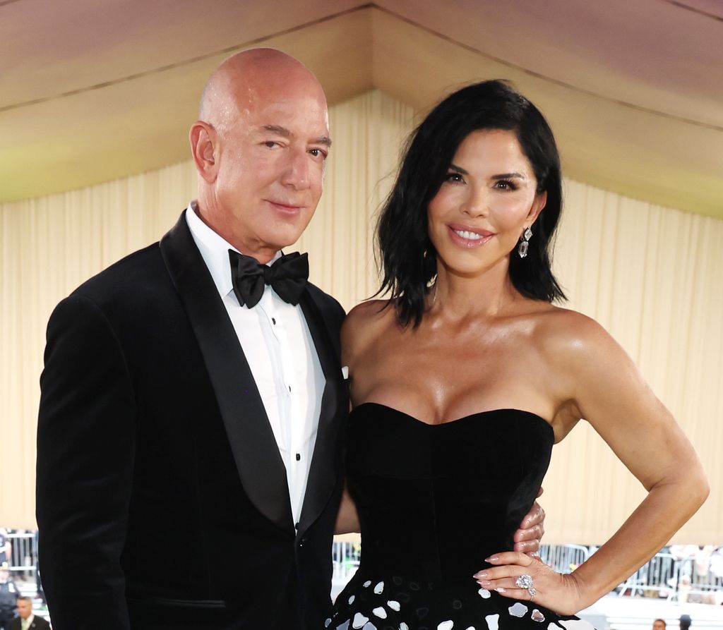 Jeff Bezos and Lauren Sanchez smiling red arpet