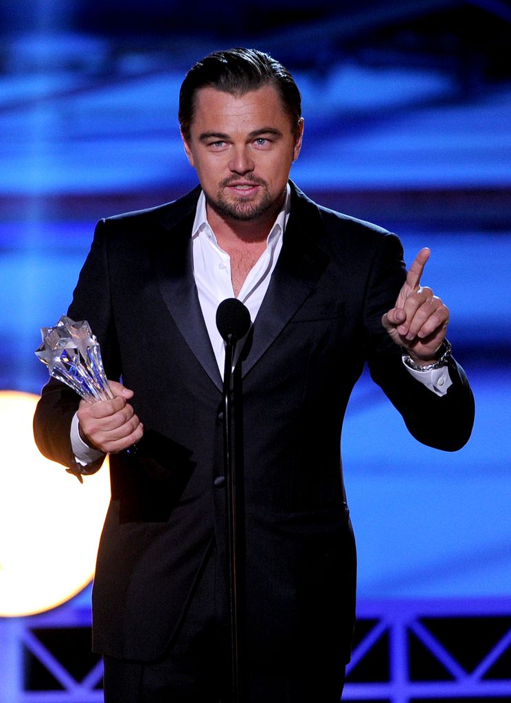 SANTA MONICA, CA - JANUARY 16:  Actor Leonardo DiCaprio accepts the award for Best Actor in a Comedy for "The Wolf of Wall Street" onstage during the 19th Annual Critics' Choice Movie Awards at Barker Hangar on January 16, 2014 in Santa Monica, California.  (Photo by Kevin Winter/Getty Images)